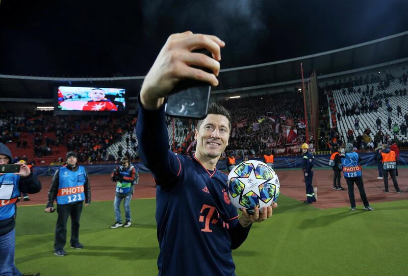 Bayern Munich's Robert Lewandowski celebrates with the match ball after scoring four against Red Star Belgrade in the Champions League on November 26. Reuters