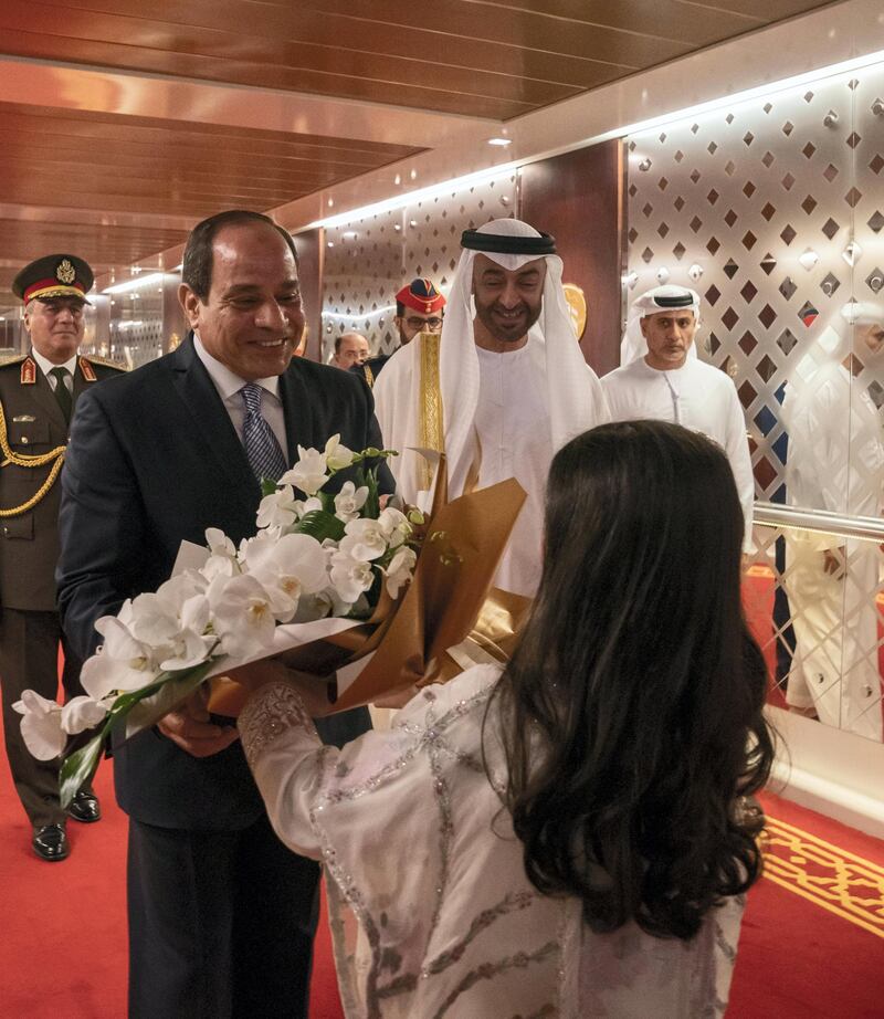 ABU DHABI, UNITED ARAB EMIRATES - November 13, 2019: HE Abdel Fattah El Sisi, President of Egypt (L), is presented with flowers upon his arrival at the Presidential Airport. Seen with HH Sheikh Mohamed bin Zayed Al Nahyan, Crown Prince of Abu Dhabi and Deputy Supreme Commander of the UAE Armed Forces (2nd L).

( Hamad Al Kaabi / Ministry of Presidential Affairs )
---
