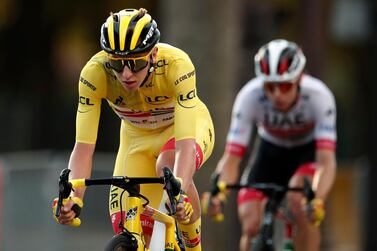 Cycling - Tour de France - Stage 21 - Mantes-la-Jolie to Paris Champs-Elysees - France - September 20, 2020. UAE Team Emirates rider Tadej Pogacar of Slovenia, wearing the overall leader's yellow jersey, in action. REUTERS/Benoit Tessier