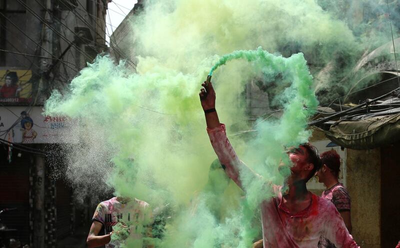People play with colours as they celebrate Holi in Jammu, India. Holi, the Hindu festival of colours, also heralds the arrival of spring. AP Photo