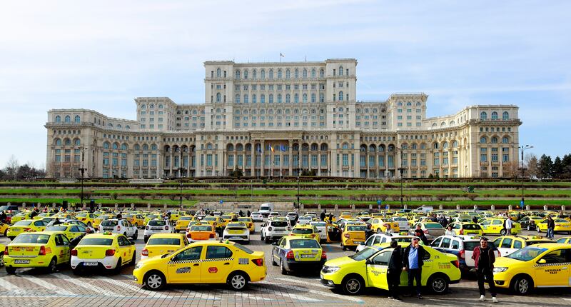 Romanian taxi drivers protest outside the national parliament building in Bucharest in a row over what they see as unfair competition from ride-sharing companies such as Uber and Bolt. EPA 