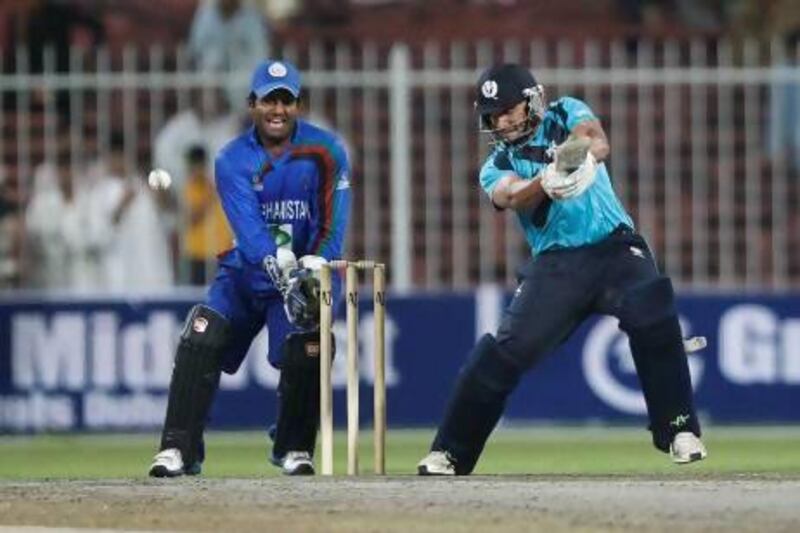 Moneeb Iqbal, of Scotland, plays a shot during a Twenty20 international against Afghanistan at Sharjah Cricket Stadium. Both sides will receive greater visibility during the World Cricket League Championship. Jake Badger for The National