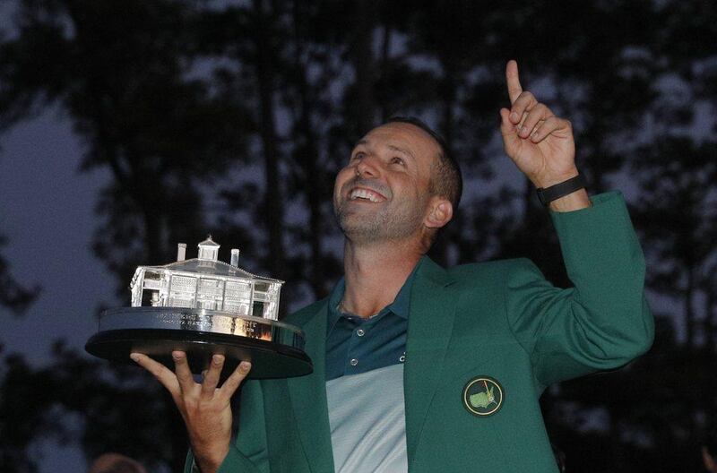 Sergio Garcia of Spain points to the sky as he holds the Masters trophy after winning the 2017 Masters at Augusta National Golf Club in Augusta, Georgia, US, April 9, 2017. Mike Segar / Reuters