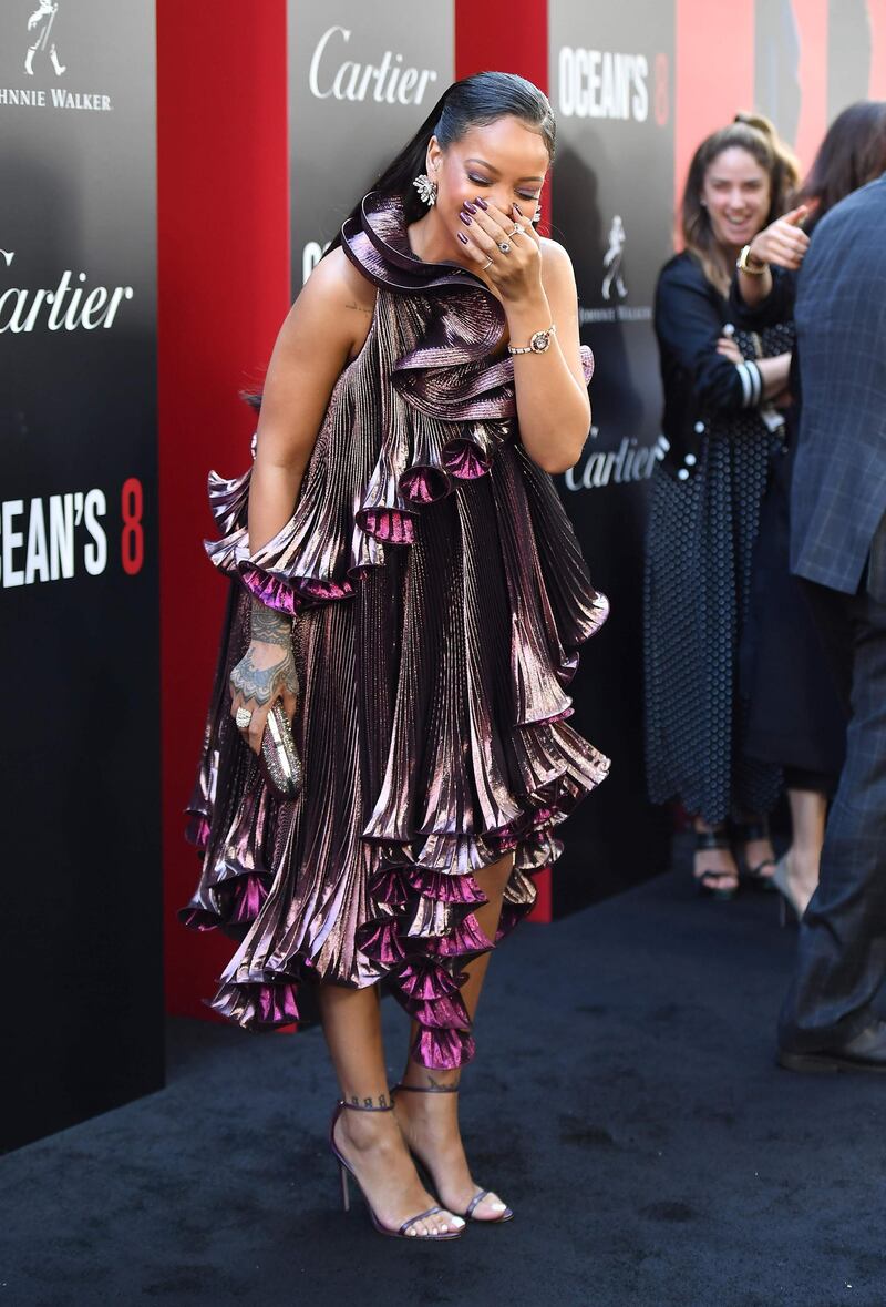 Rihanna looks like a walking botanical delight in a blooming Givenchy metallic dress. AFP