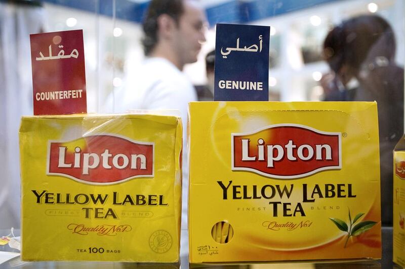 Counterfeit and genuine Lipton tea at the Anti-Commercial Counterfeiting Exhibition organised by the Department of Planning & Economy at Abu Dhabi Mall. Philip Cheung / The National