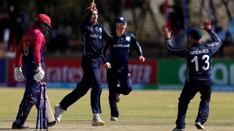 Brandon McMullen of Scotland celebrates after taking the wicket of Rohan Mustafa of United Arab Emirates during the ICC Men´s Cricket World Cup Qualifier Zimbabwe 2023 match. ICC