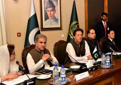 In this photo released by the Press Information Department, Pakistani Prime Minister Imran Khan, center, attends a briefing at the Foreign Ministry in Islamabad, Pakistan, Friday, Aug. 24, 2018. A telephone call made by U.S. Secretary of State Mike Pompeo to congratulate Pakistan's newly elected Prime Minister Khan has stirred controversy, with Washington saying it "raised the importance of Pakistan taking decisive action against all terrorists" operating in the country. Pakistani Foreign Minister Shah Mehmood Qureshi seen second from left. (Press Information Department, via AP)