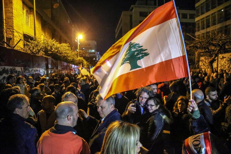epa08232595 Supporters of the Free Patriotic Movement, during a protest against central bank in Hamra, Beirut, Lebanon, 20 February 2020. Protesters are demanding to return stolen money that was transferred into accounts in Swiss banks. Moreover, there was a clash between the supporters of the Progressive Socialist Party 'Of Walid Jumblatt', after they blocked the road and prevented the supporters of President Michel Aoun from the Free Patriotic Movement from reaching the central bank, and the Lebanese army and riot police intervened to separate the supporters of the two parties.  EPA/NABIL MOUNZER