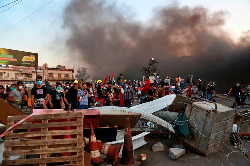 Anti-government protests set fire and close streets in Baghdad. AP Photo