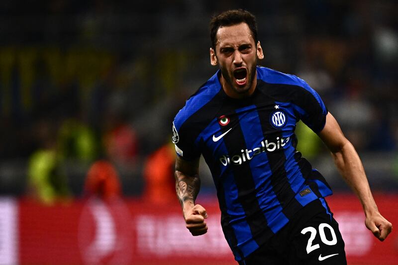 Inter Milan's Hakan Calhanoglu celebrates after scoring the only goal in the 1-0 Champions League victory against Barcelona at the San Siro on October 4. AFP