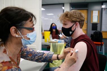 Christopher Nicholas, 18, receives his first dose of the Pfizer vaccine on June 6, 2021 in Stanmore, Greater London. Getty Images
