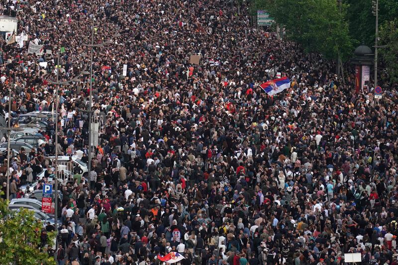 Protesters march during a rally to call for the resignation of top officials and curtailing violence in the media, after two mass shootings that killed 18 people earlier this month, in Belgrade. AFP
