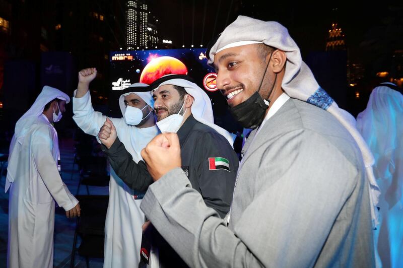 Dubai, United Arab Emirates - Reporter: Sarwat Nasir. News. Mars Mission. People celebrate at an event at Burj Park to celebrate the Hope probe going into orbit around Mars. Tuesday, February 9th, 2021. Dubai. Chris Whiteoak / The National