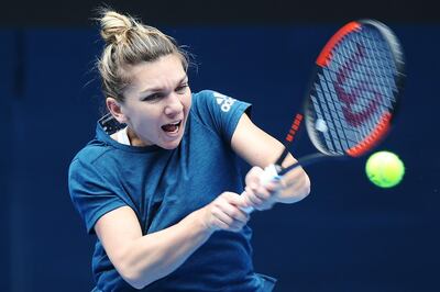 MELBOURNE, AUSTRALIA - JANUARY 10:  Simona Halep of Romania hits a backhand during a practice session ahead of the 2018 Australian Open at Melbourne Park on January 10, 2018 in Melbourne, Australia.  (Photo by Michael Dodge/Getty Images)