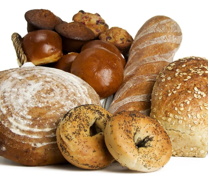 Whole Grain breads with wheat stalks. Courtesy iStockphoto 