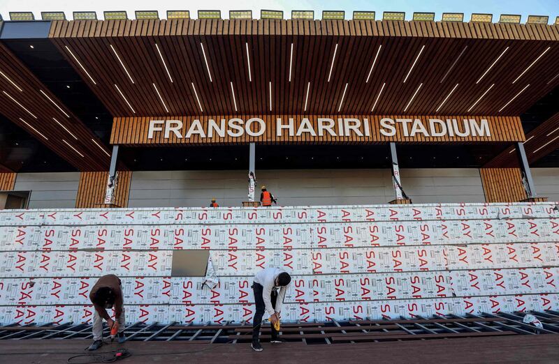 Workers finalise preparations for the Pope's visit to Franso Hariri Stadium in Erbil. AFP