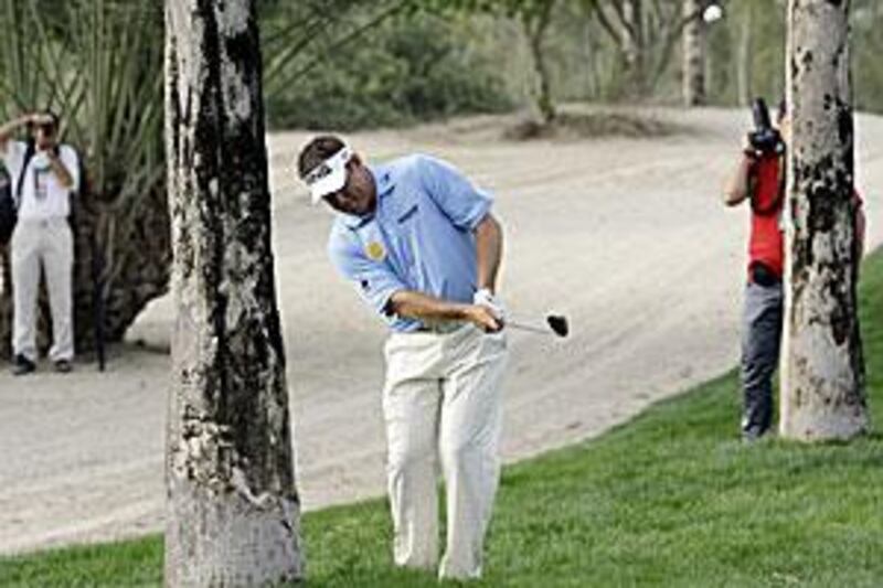 England's Lee Westwood plays out of a tough spot on the 15th hole during the second round.