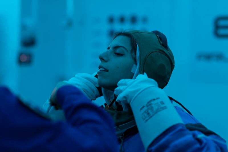 Ms Sabry puts on a space suit during training in Poland in 2021. Photo: LunAres Research Station