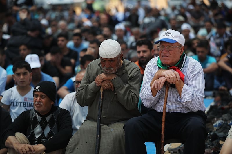 GAZA CITY, GAZA - MAY 11:  Palestinians participate in Friday Prayer near the border fence with Israel as mass demonstrations at the fence continue on May 11, 2018 in Gaza City, Gaza. One man was killed while dozens, some critically, were wounded in the protests that are part of weekly Friday demonstrations along Gaza's border with Israel. For the 1.9 million Palestinians living inside the Gaza Strip life has become a daily struggle for food, electricity and money after 10 years of an Israeli blockade on the area. The protests have so far left 40 Palestinian dead and over 1,700 wounded by Israeli army fire. Gaza's Hamas rulers have vowed that the marches will continue until the decade-old Israeli blockade of the territory is lifted. On May 15 the protests will culminate to mark the 'nakba',  or catastrophe, to commemorate the anniversary of their mass uprooting during the 1948 war over Israel's creation.  (Photo by Spencer Platt/Getty Images)