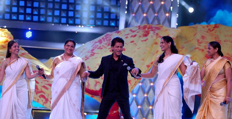 Bollywood actor Shah Rukh Khan, centre, and personnel from the Mumbai police. Sujit Jaiswal / AFP