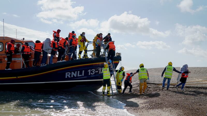 A group of people thought to be migrants are brought in to Dungeness, Kent, by the RNLI following a small boat incident in the Channel. PA