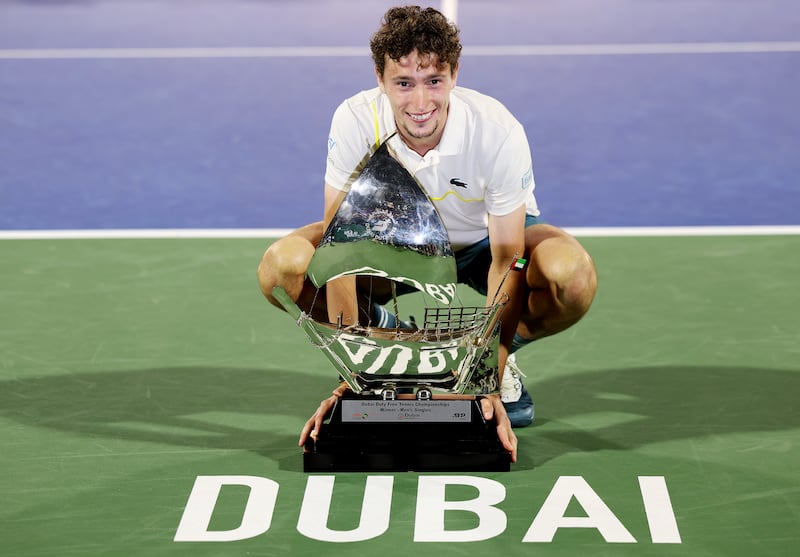 Ugo Humbert celebrates with the trophy after his victory against Alexander Bublik. Getty Images