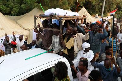 Sudanese protesters take to the streets in the capital Khartoum durning a demonstration demanding the dissolution of the transitional government, on October 20, 2021. AFP