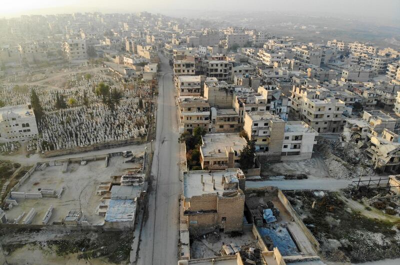 A drone picture shows empty streets and damaged buildings in Maaret Al Numan.  AFP