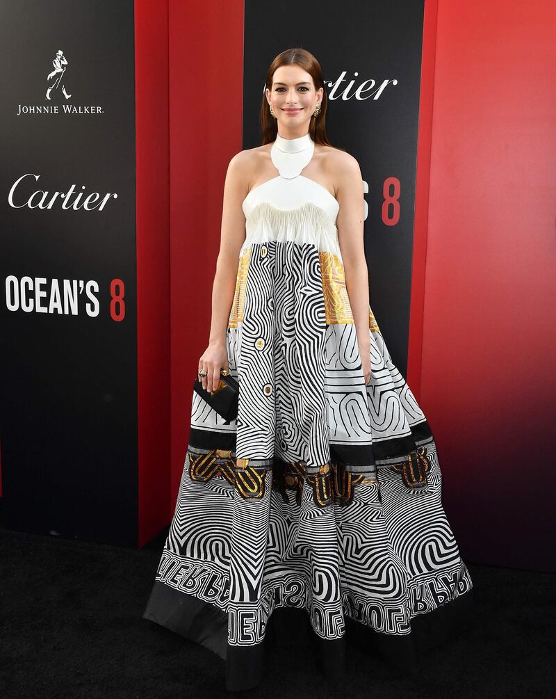 Anne Hathaway wore a statement print by Gaultier (which was paired with a bold gold necklace on the runway, which we kind of miss here). AFP