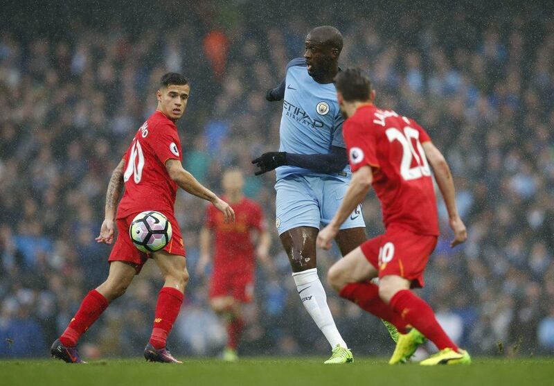 Yaya Toure, centre, in action for Manchester City against Liverpool in the 1-1 Premier League draw on Sunday. Andrew Yates / Reuters