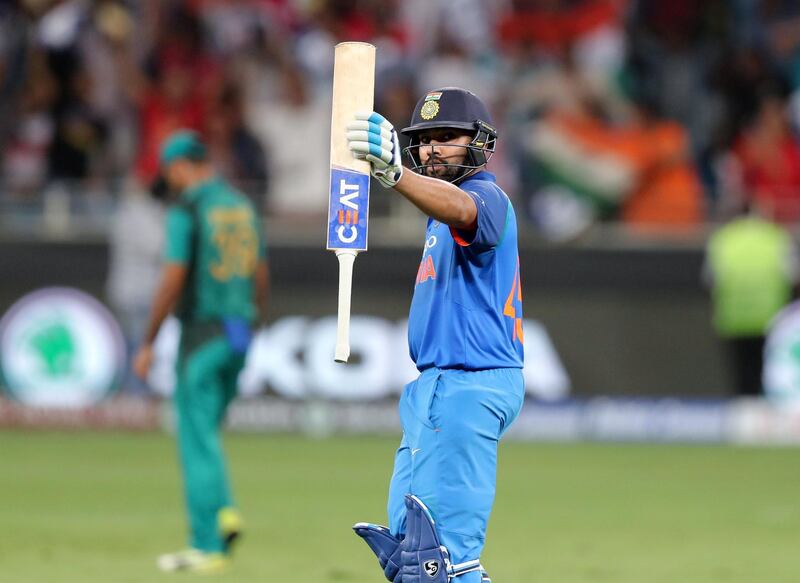 Dubai, United Arab Emirates - September 23, 2018: India's Rohit Sharma makes 50 during the game between India and Pakistan in the Asia cup. Sunday, September 23rd, 2018 at Sports City, Dubai. Chris Whiteoak / The National