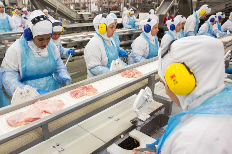 (FILES) In this file photo taken on March 21, 2017 people work at a production line of the JBS-Friboi chicken processing plant during an inspection visit from Brazilian Agriculture Minister Blairo Maggi and technicians of the ministry in Lapa, Parana State, Brazi.  JBS USA, the American subsidiary of the world's largest meat processing company, said May 31, 2021 it had been hacked.
"JBS USA determined that it was the target of an organized cybersecurity attack, affecting some of the servers supporting its North American and Australian IT systems," the unit said in a statement. The intrusion was detected Sunday, it said.
 / AFP / RODRIGO FONSECA
