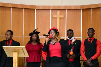 Orji Nneka from the Garden of Peace Choir sings during Sunday morning mass. Khushnum Bhandari / The National