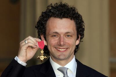LONDON - JUNE 2: Actor Michael Sheen with the OBE he received earlier from Queen Elizabeth II during investitures at Buckingham Palace on June 2, 2009 in London, England. (Photo by Lewis Whyld - WPA Pool/Getty Images)