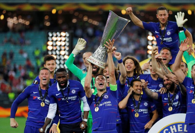 Chelsea's Cesar Azpilicueta and team mates celebrate winning the Europa League with the trophy. REUTERS