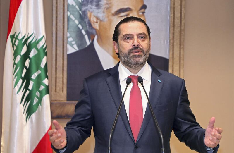 In this handout picture provided by the Lebanese photo agency Dalati and Nohra, Lebanon's Prime Minister Saad Hariri announces the resignation of his governmentt in the capital Beirut on October 29, 2019, bowing to nearly two weeks of unprecedented nationwide protests. - Hariri's express and sombre televised address was met by cheers from crowds of protesters who have remained mobilised since October 17, crippling the country to press their demands. (Photo by - / DALATI AND NOHRA / AFP) / === RESTRICTED TO EDITORIAL USE - MANDATORY CREDIT "AFP PHOTO / HO / DALATI AND NOHRA" - NO MARKETING - NO ADVERTISING CAMPAIGNS - DISTRIBUTED AS A SERVICE TO CLIENTS ===