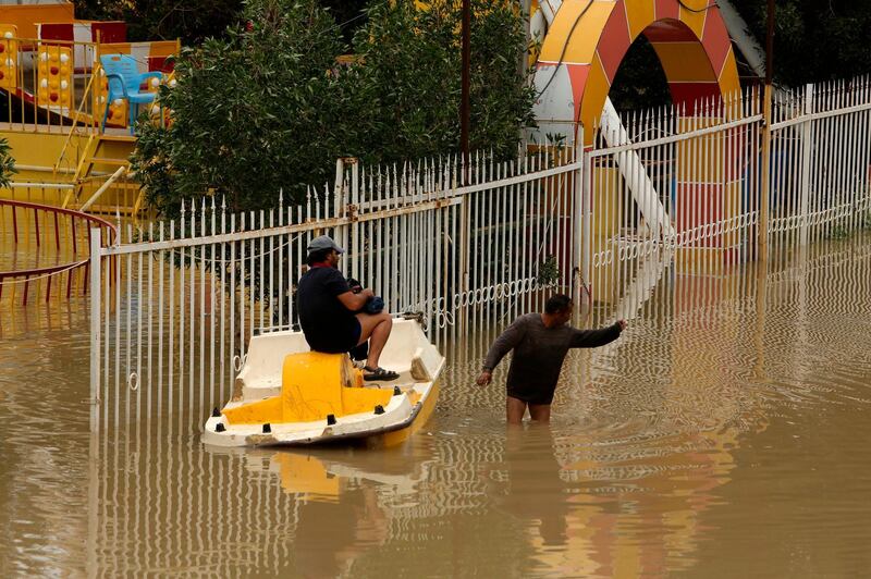 Parks and restaurants lies partially submerged alongside the Tigris river, in Baghdad, Iraq, Sunday, April 7, 2019. Iraqi authorities alerted the public of possible severe weather, heavy rains and flooding throughout Iraq. The heavy rainfall has caused damage to property as well as disruption to transport and power supplies. (AP Photo/Hadi Mizban)