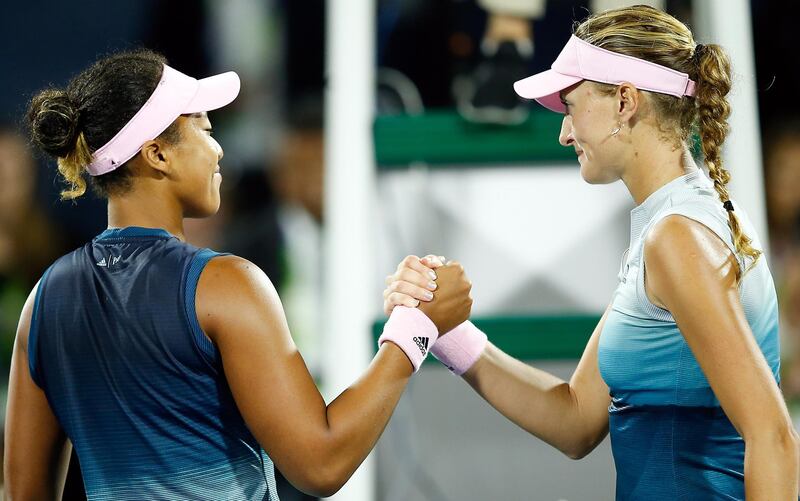 epa07381245 Kristina Mladenovic (R) of France shakes hands with Naomi Osaka of Japan after her second round match at the Dubai Duty Free Tennis WTA Championships 2019 in Dubai, United Arab Emirates, 19 February 2019.  EPA/ALI HAIDER