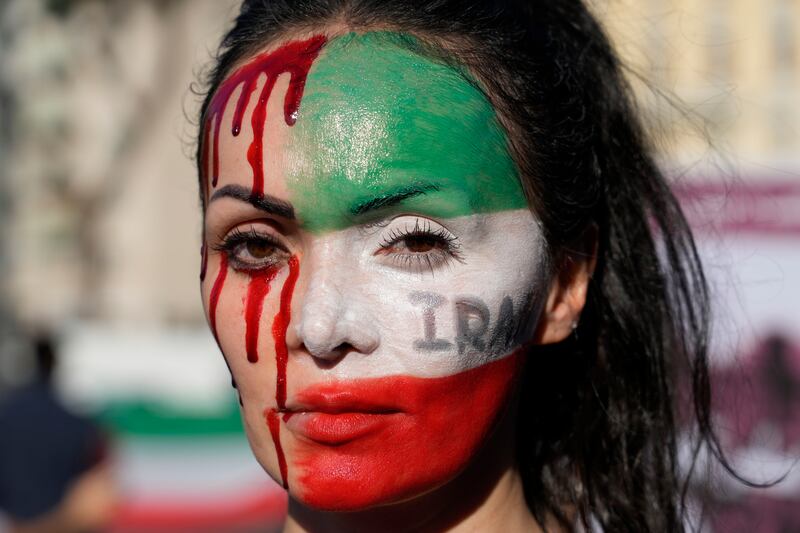 A woman attends a protest against the death of Mahsa Amini in Rome, Italy, on October 29.   AP Photo