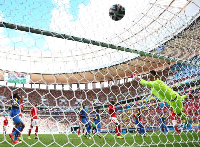 Enner Valencia of Ecuador scores his team's first goal on a header past Diego Benaglio of Switzerland during their match at the 2014 World Cup on Sunday. Clive Brunskill / Getty Images