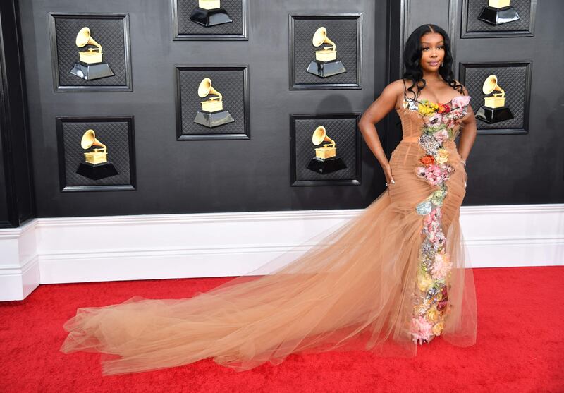 SZA, wearing a floral gown. AFP