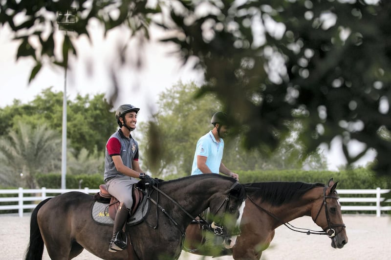 ABU DHABI, UNITED ARAB EMIRATES - OCTOBER 21, 2018. 

Omar Al Marzooqi, left, rides Ugoline at Al Bahia's Equestrian Stable.

Omar Al Marzooqi made history as the first Emirati to medal at the Youth Olympic Games after claiming silver in the individual showjumping.

Al Marzooqi, who was onboard La Corina Lala, led five riders into the jump-off after each had completed clear rounds on Friday and Saturday at the Club Hipico Argentino on the outskirts of Buenos Aires.

Omar Al Marzooqi made history as the first Emirati to medal at the Youth Olympic Games after claiming silver in the individual showjumping on Sunday.

Al Marzooqi, is trained by his father, Abdulaziz.


(Photo by Reem Mohammed/The National)

Reporter: Amith
Section:  SPORTS