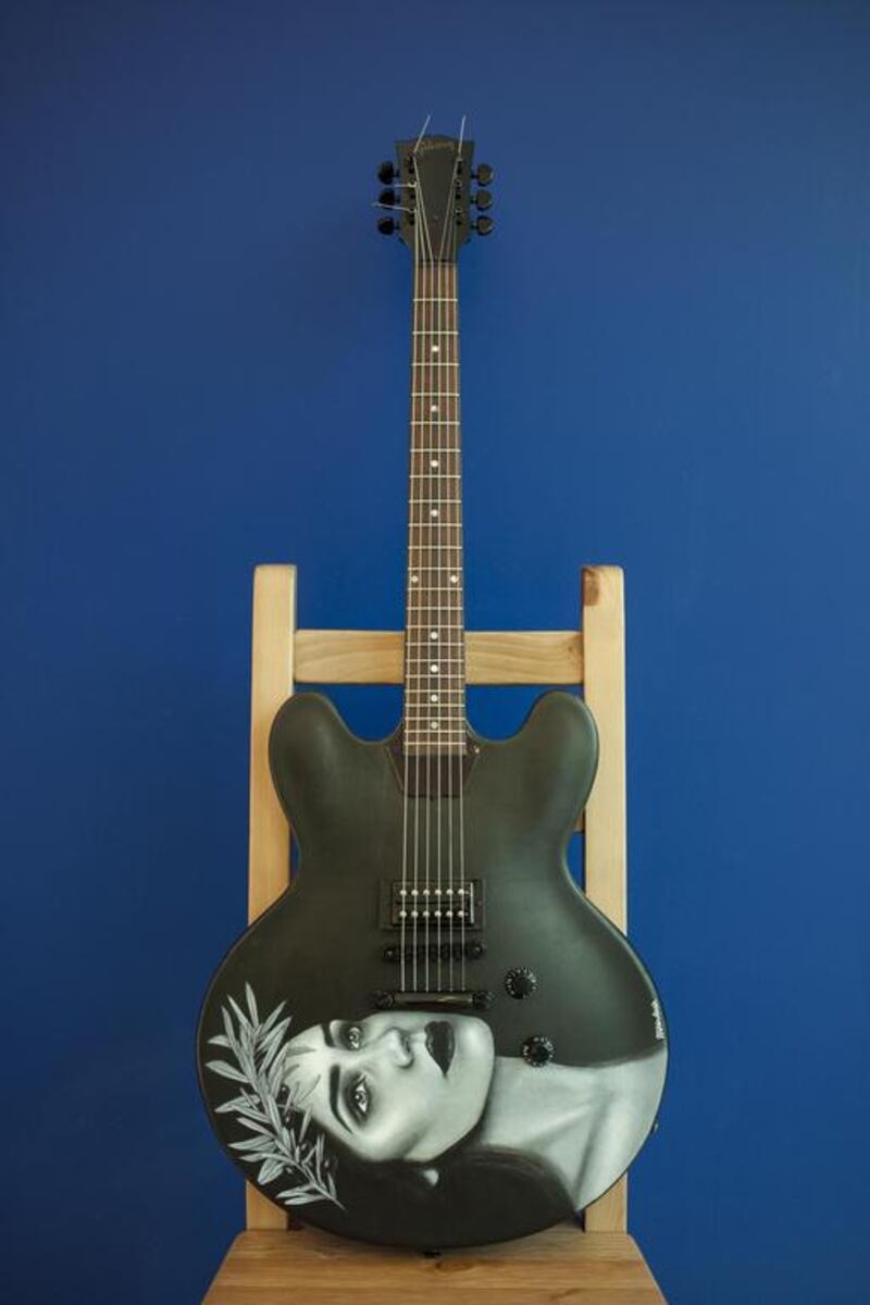An ES Gibson guitar decorated by artist Mohammed Hindash from the Jordan titled Eirene. Antonie Robertson / The National