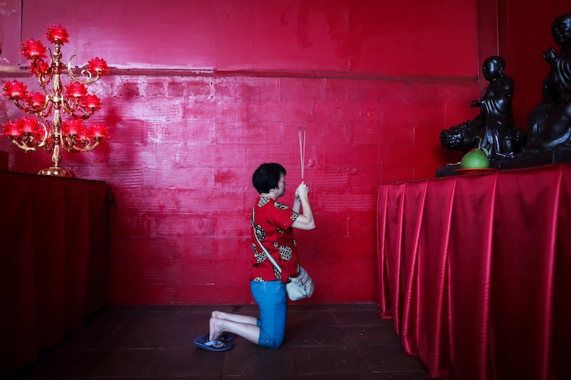 An Indonesian Chinese woman  prays at Dharma Sakti temple in Jakarta. Mast Irham / EPA