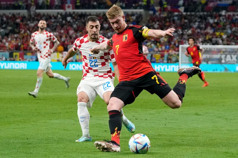 Belgium's Kevin De Bruyne, right, and Croatia's Josip Juranovic, left, fight for the ball. AP