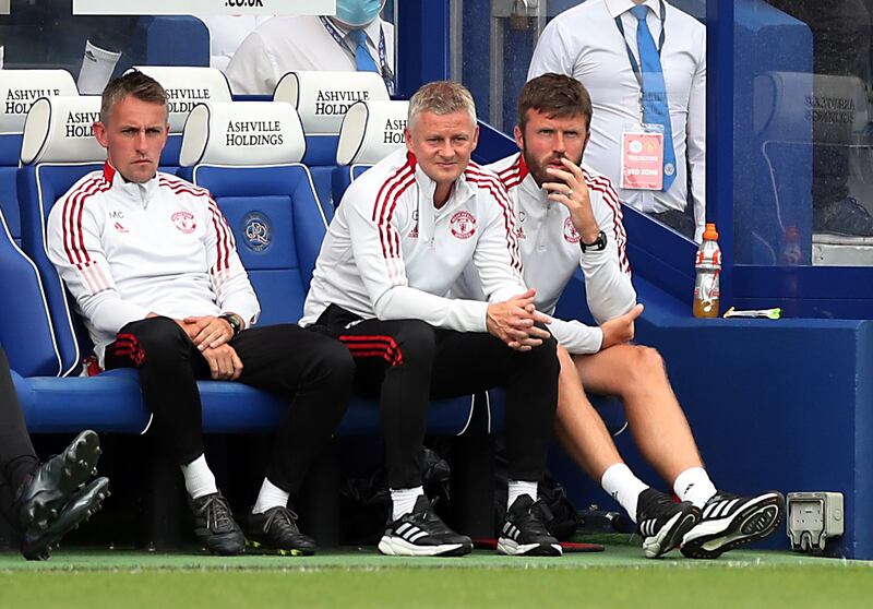 Manchester United manager Ole Gunnar Solskjaer with coaching staff during the pre-season friendly against Queens Park Rangers at Loftus Road on Saturday, July 24.