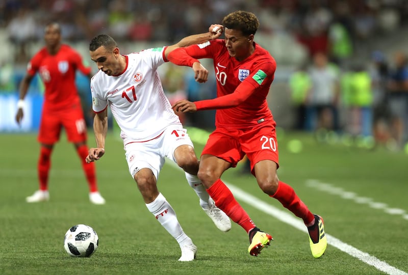 VOLGOGRAD, RUSSIA - JUNE 18:  Ellyes Skhiri of Tunisia is tackled by Dele Alli of England during the 2018 FIFA World Cup Russia group G match between Tunisia and England at Volgograd Arena on June 18, 2018 in Volgograd, Russia.  (Photo by Clive Rose/Getty Images)
