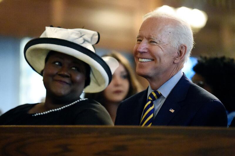 FILE - In this July 7, 2019, file photo, Democratic presidential candidate and former Vice President Joe Biden attends a Sunday service at Morris Brown AME Church in Charleston, S.C. Democrats are betting on Bidenâ€™s evident comfort with faith as a powerful point of contrast in his battle against President Donald Trump.(AP Photo/Meg Kinnard, File)