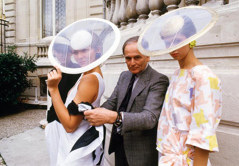 Paris couturier Pierre Cardin with pieces from his spring / summer 1985 ready-to-wear  collection pose in Paris. AP