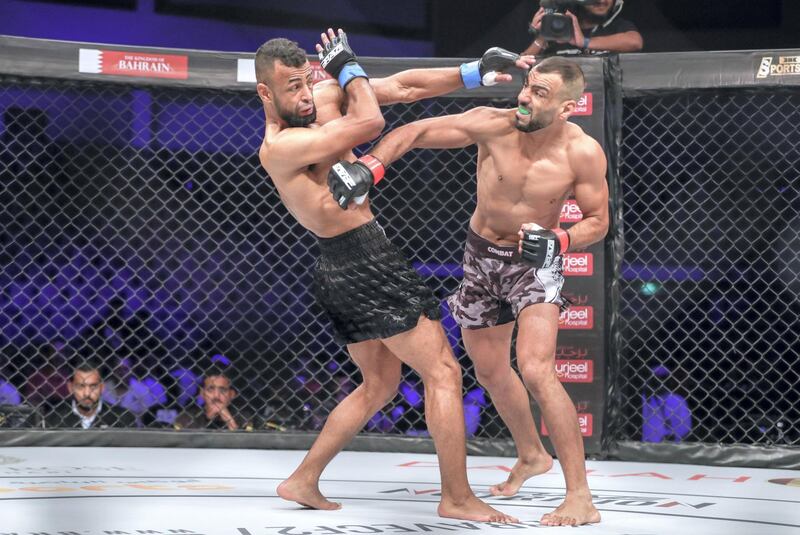 Abu Dhabi, United Arab Emirates, October 4, 2019.   --  Brave Combat Federation 27 at the Mubadala Arena.
Bantamweight:
(R-L) Jalal Al Daaja (JOR) swings a light hook in his bout against Tariq Ismail (CAN).
Victor Besa / The National
Section:  SP
Reporter:  Amith Passela